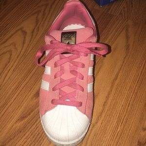 Pink and white adidas superstars